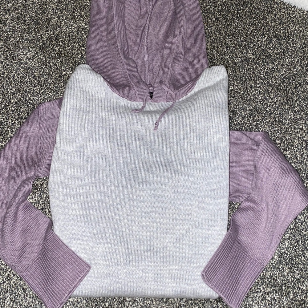 Two-toned, grey and purple, hooded sweatshirt with a pocket, size small